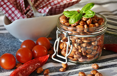 brown peanuts in glass jar thumbnail