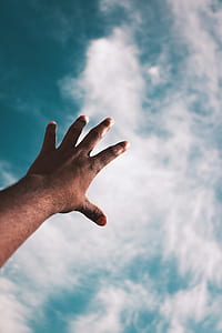 person's left hand in the air thumbnail