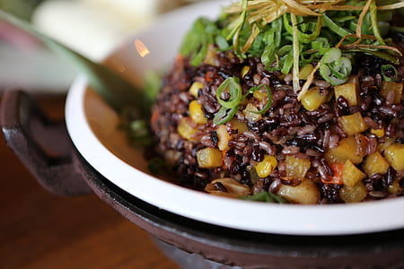 selective focus photography of fried rice bowl with spring onion toppings thumbnail
