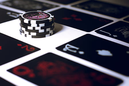 black-and-white poker chips on surface thumbnail