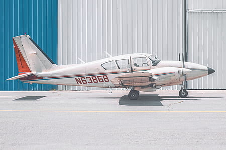 shallow focus photography of white airplane thumbnail