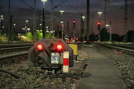 red LED light on railway at night thumbnail
