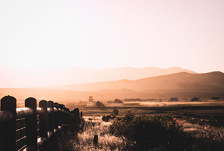 landscape photography of fence near of field thumbnail