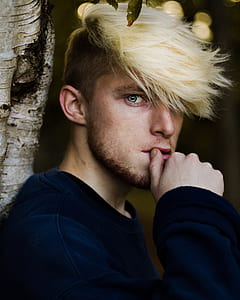 closeup photography of man in black long-sleeved shirt thumbnail