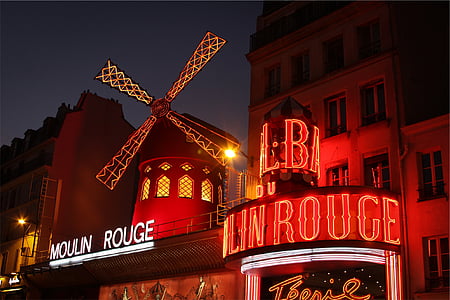 red windmill tower at night time thumbnail