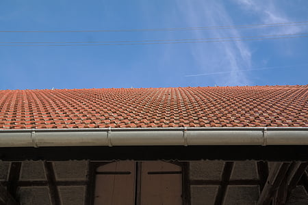 orange roof shingles under blue skies at daytime thumbnail