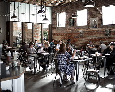 group of people inside cafe during daytime thumbnail