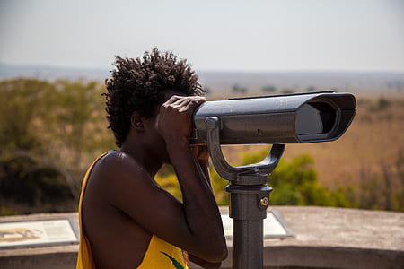 person looking through a telescope thumbnail
