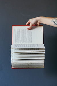 person holding book thumbnail