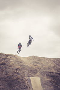 two man riding motocross bikes thumbnail