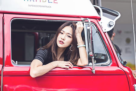 woman sitting inside the red car thumbnail