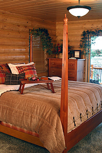 rectangular brown wooden tray on brown comforter sheet inside bedroom thumbnail