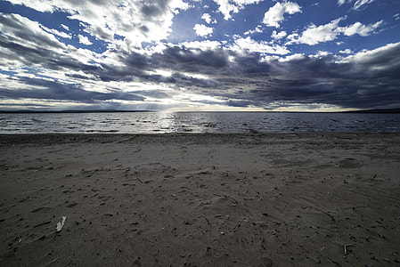 Beach and Shoreline with clouds and sky with sun thumbnail