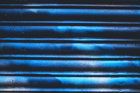 Close-up shot of blue metal thumbnail