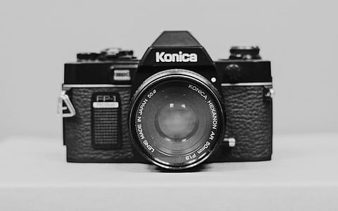 black Konica DSLR camera with white background thumbnail