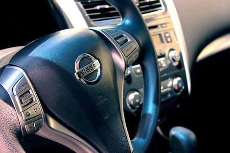 black Nissan steering wheel on focus photo thumbnail
