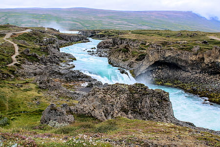 waterfalls between mountains thumbnail