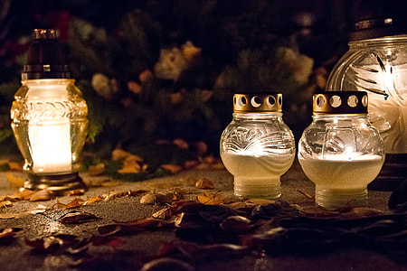four lighted clear glass candle holders thumbnail
