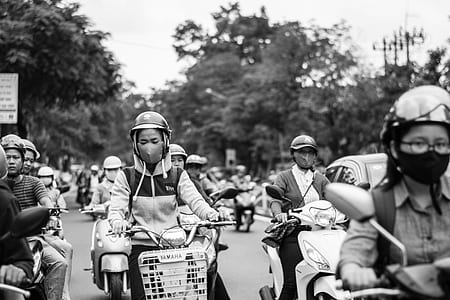grayscale photography of motorist during daytime thumbnail