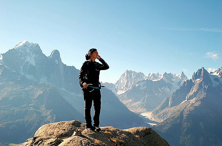 woman on gray top of the mountain during daytime thumbnail