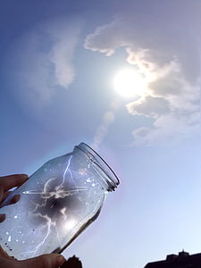 photography of jar reflecting on sun thumbnail
