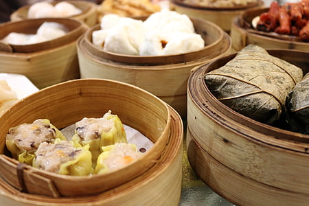 brown dumpling on brown steam wooden tray thumbnail