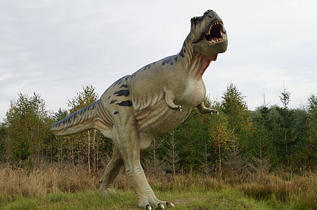 dinosaur on green grass thumbnail