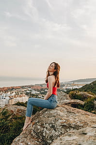 woman sitting on rock thumbnail