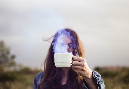 woman holding cup with smoke thumbnail
