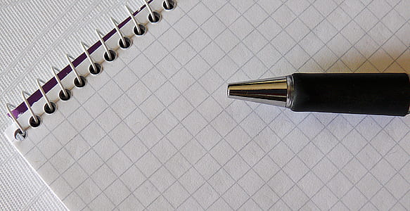 black ballpoint pen on white line paper thumbnail