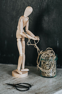 Wooden mannequin in various poses thumbnail