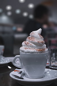 tilt shift lens photography of white ceramic cup with wheat cream thumbnail