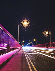 time lapse photography of cars on road with turned-on road lights thumbnail