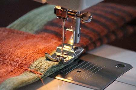 selective focus photography of sewing machine thumbnail