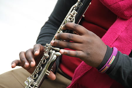 person playing clarinet close-up photo thumbnail
