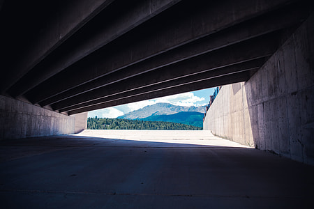 gray concrete tunnel road during daytime thumbnail