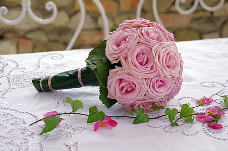 bouquet of pink roses on white table top thumbnail