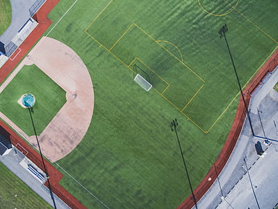 aerial photography of green soccer field during daytime thumbnail