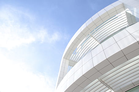 architectural photography of white concrete building thumbnail