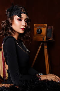 woman standing near folding camera thumbnail