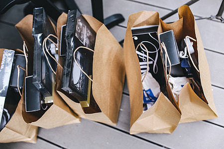 Brown paper shopping bags full of decorations thumbnail