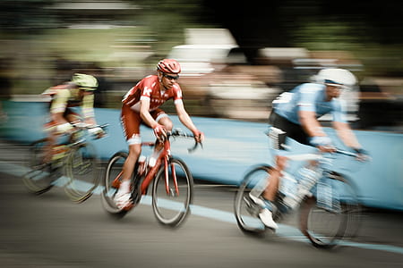 man in red shirt riding on bike thumbnail