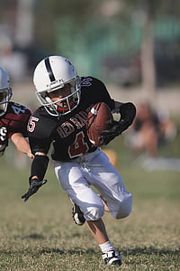 boy defending football on the grass thumbnail