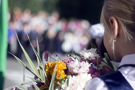 woman smelling flower thumbnail