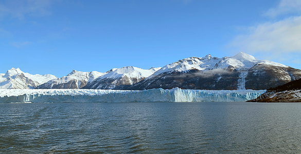mountain covered snow near body of water with iceberg at daytime thumbnail