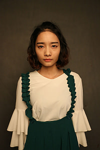 woman wearing white and green dress thumbnail