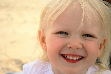 shallow focus photography of girl in white top garment thumbnail