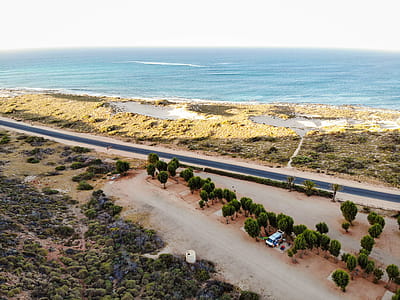 Aerial Shot Of Road Near Body Of Water thumbnail