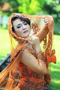woman in orange and grey floral sequin dress thumbnail
