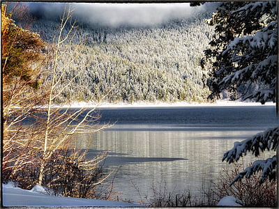 lake under cloudy sky during daytime thumbnail